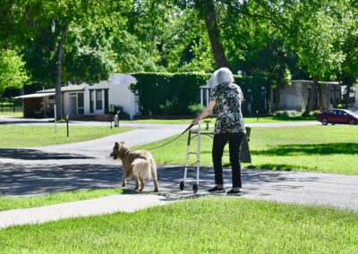 Resident and dog walking